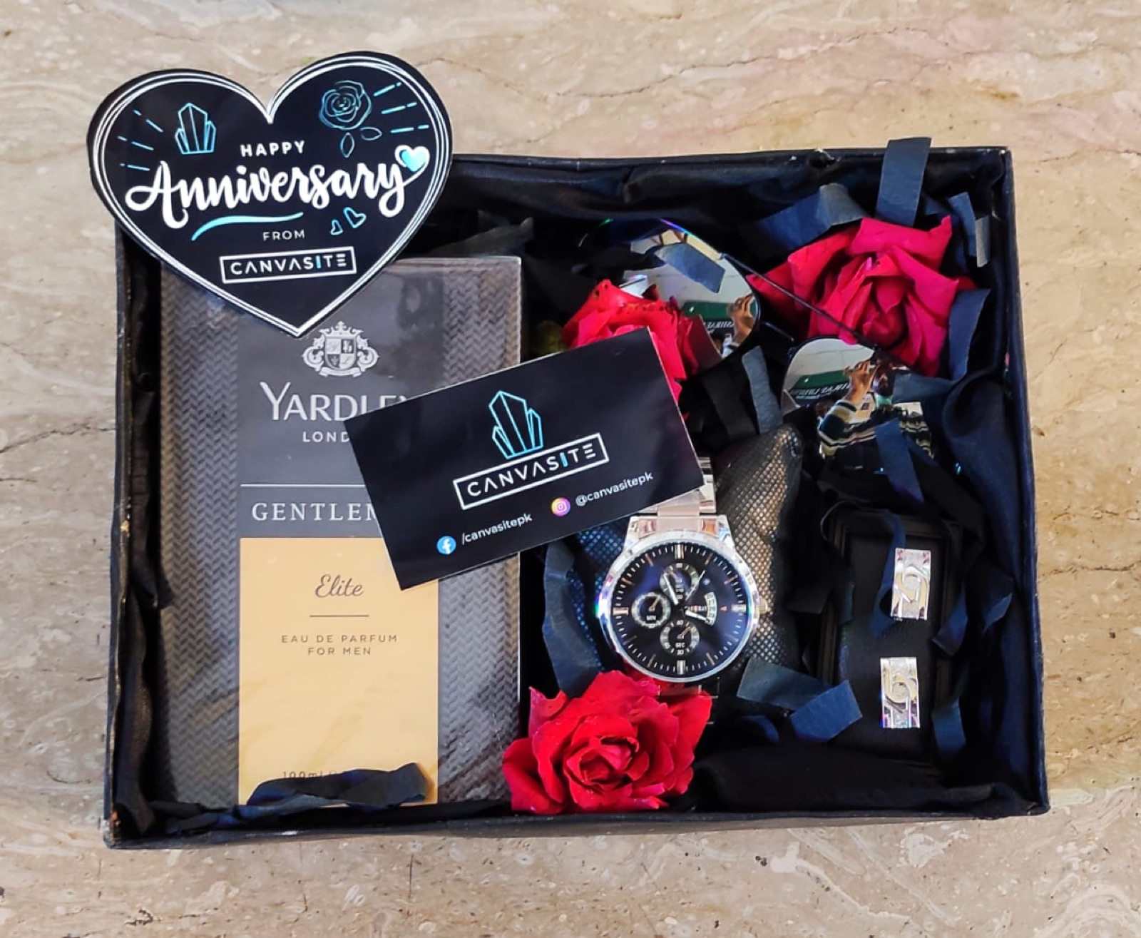 Anniversary box with watch, wallet, perfume and roses