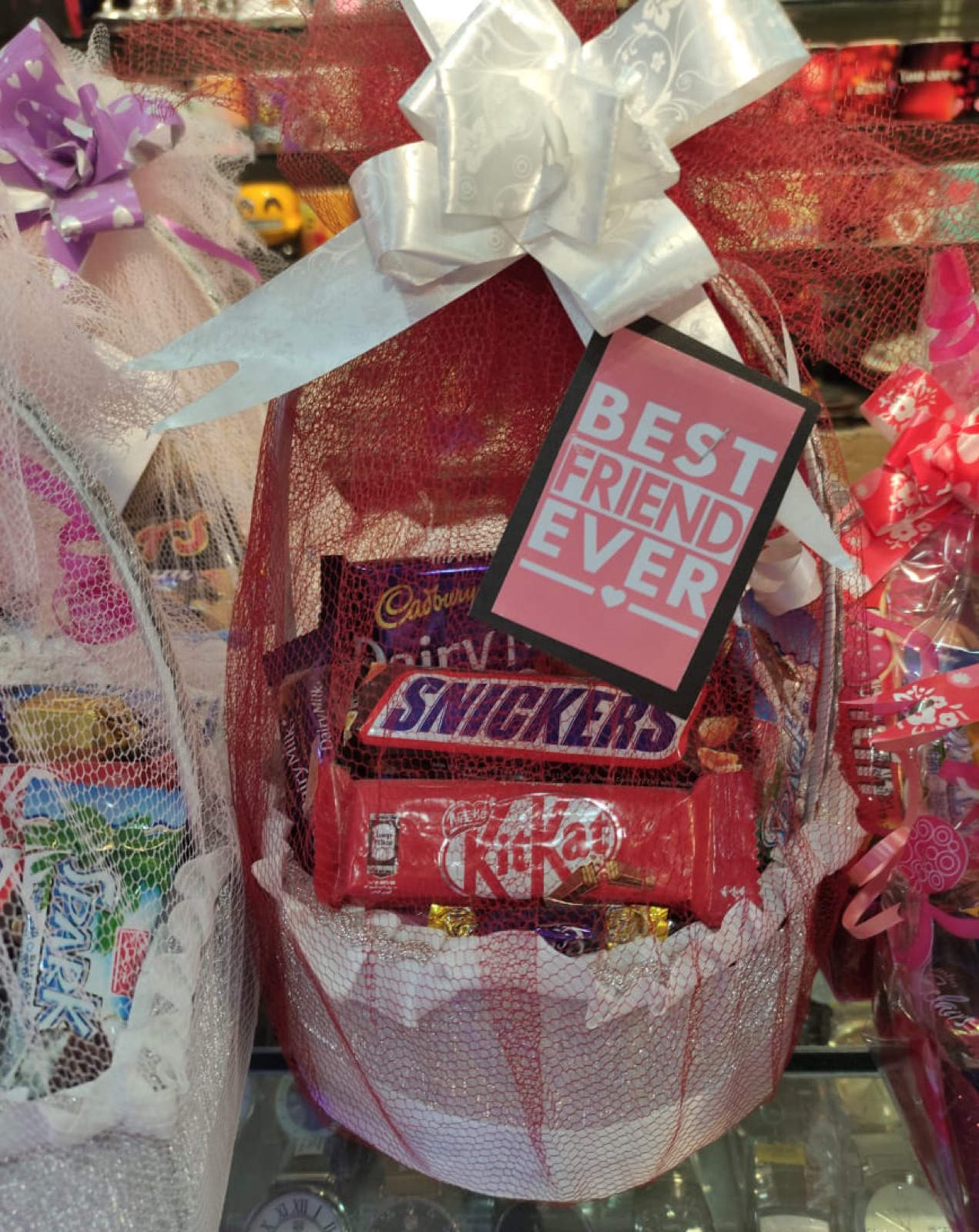 Wrapped snack basket with chocolates and Snickers