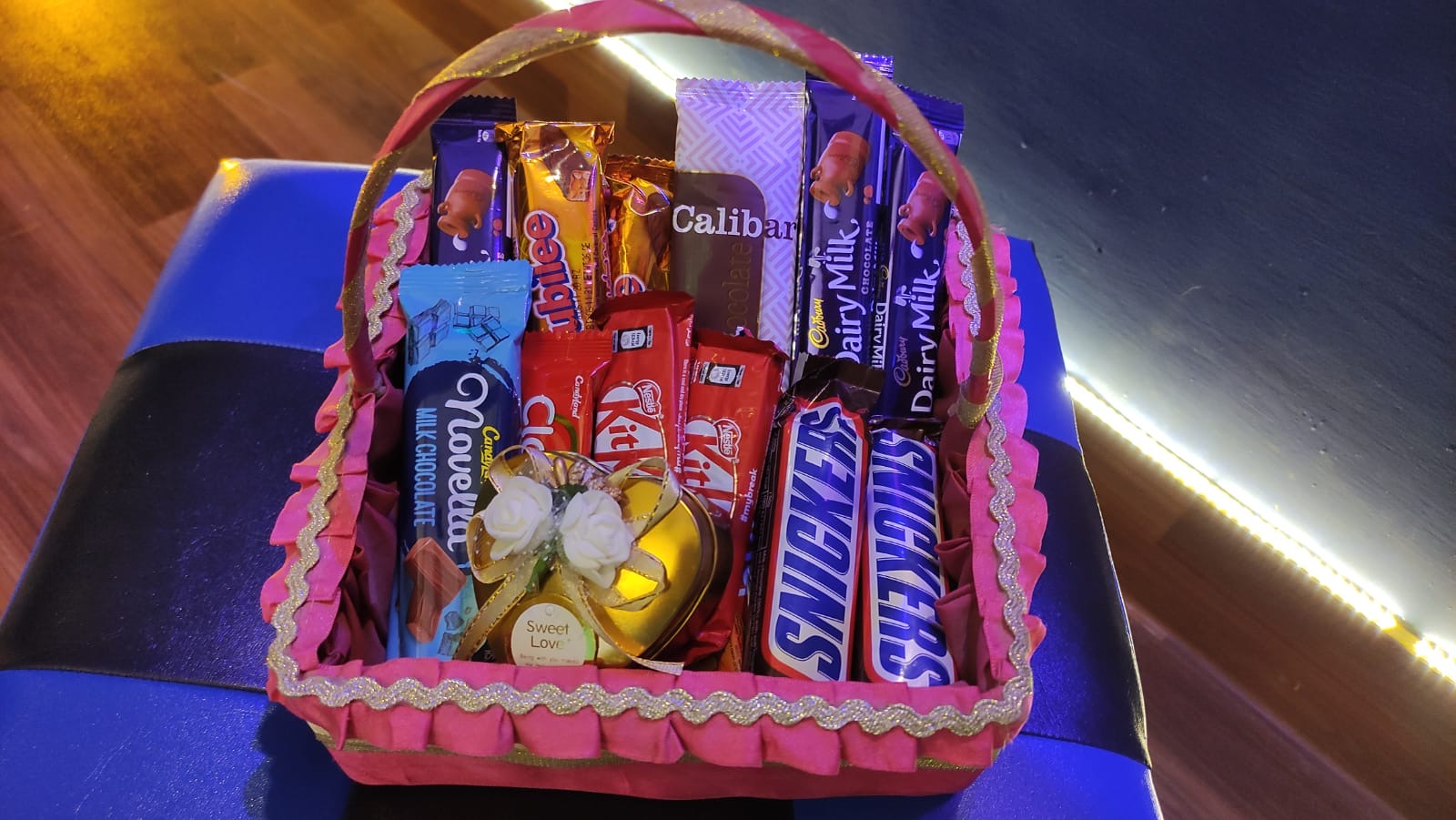 Chocolate and snack basket in pink wrap