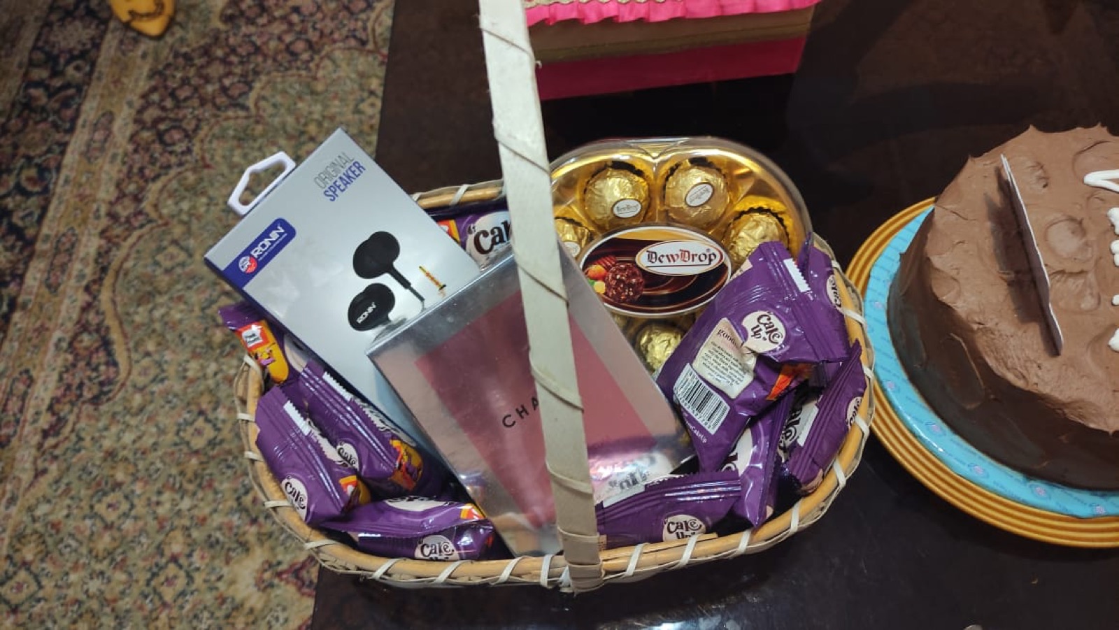 Basket with chocolates and perfume